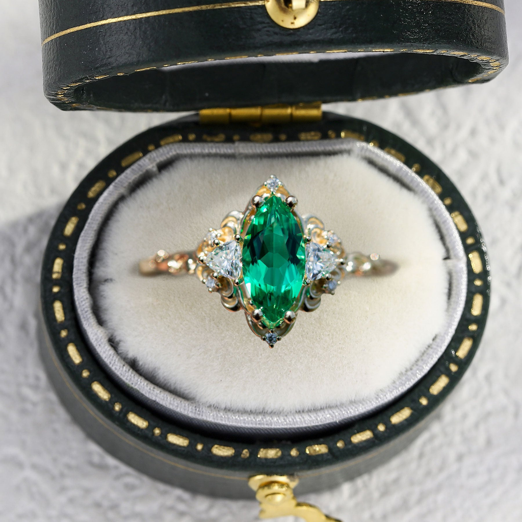 Emerald Moissanite Statement Ring in Gold Finish – 10×5mm Center Stone, Elegant Three-Stone Design