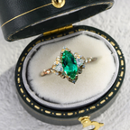Emerald Moissanite Statement Ring in Gold Finish – 10×5mm Center Stone, Elegant Three-Stone Design